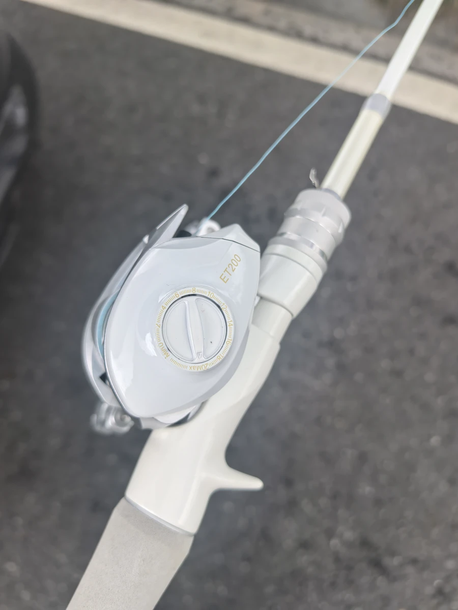 Sleek White Combo rod handle and reel detail